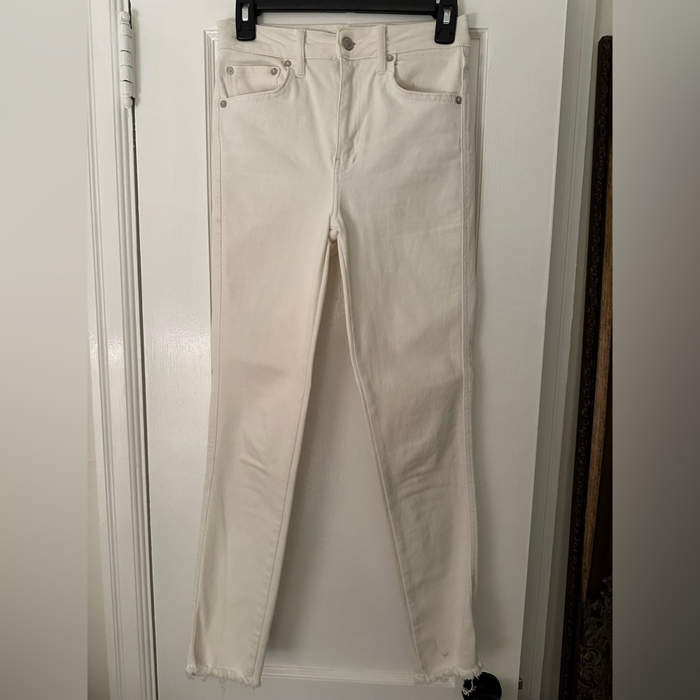 Free People white skinny jeans; raw hem; size 27